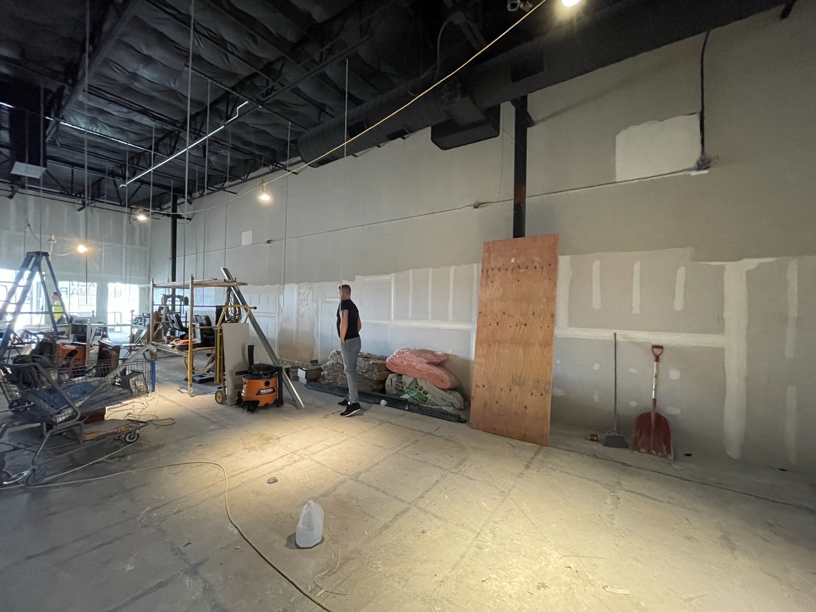 Open floor with drywall up, finish work next